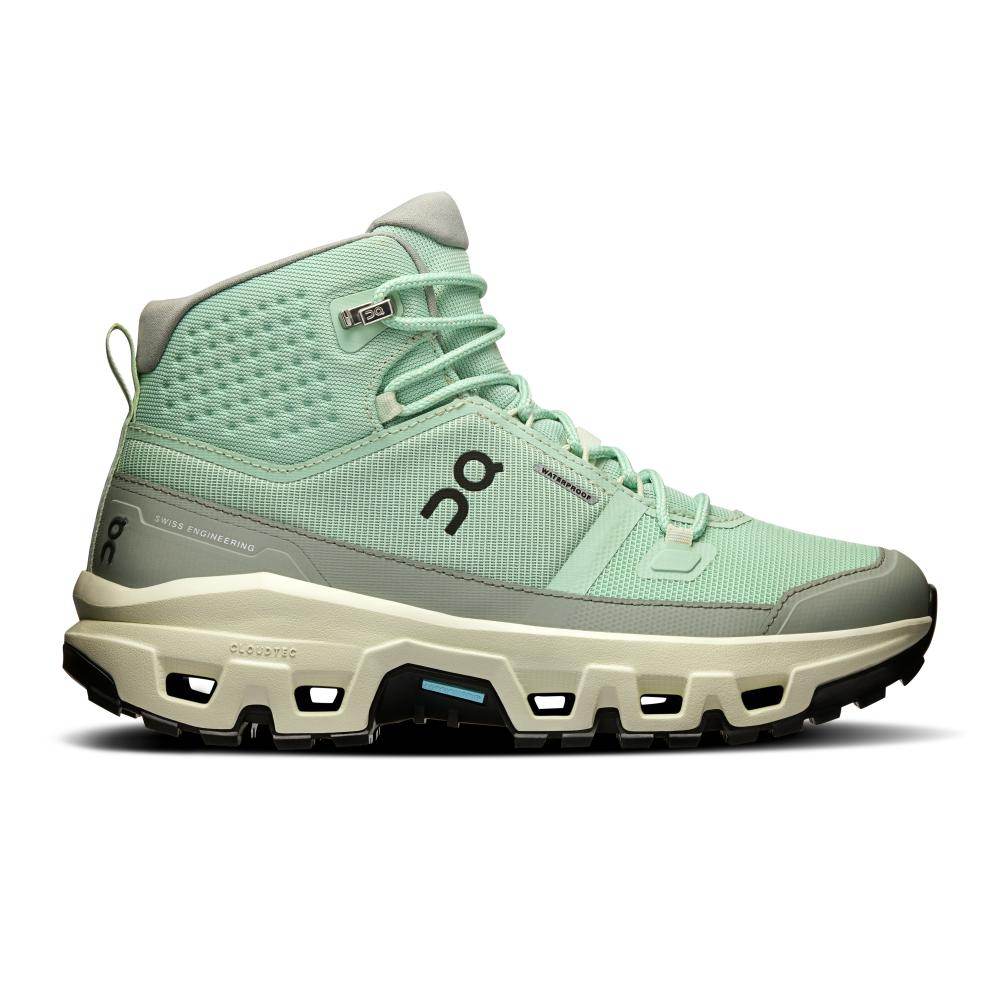 נעלי On Cloud נעלי און קלאוד רוק לנשים Cloudrock Mid WP MineralAloe 3WF10132078 מתאפיינות בעיצוב גבוה בצבעי ירוק מנטה ואפור, סוליה מחוספסת ולוגו ON — נעלי הייקינג לנשים אידיאליות הן מבחינת סגנון והן מבחינת ביצועים.
