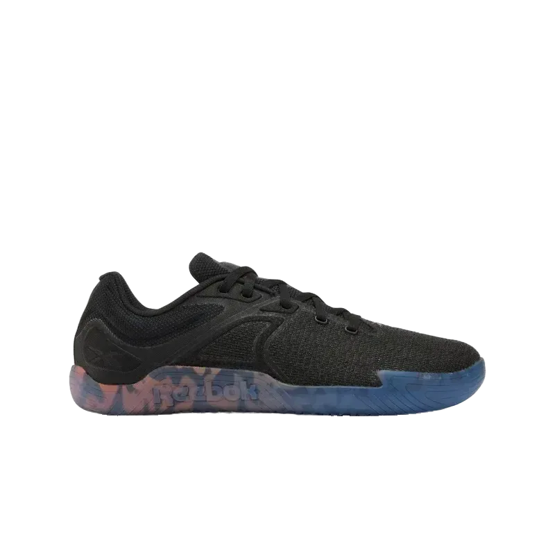 ה-Reebok Nano Zero U 100244705 מבית Reebok הוא נעל ספורט שחורה עם חלק עליון מרקם, שרוכים שחורים וסוליה במראה שיש בצבעים כחול וורוד עזים, המוצגת בפרופיל צדדי על רקע לבן.