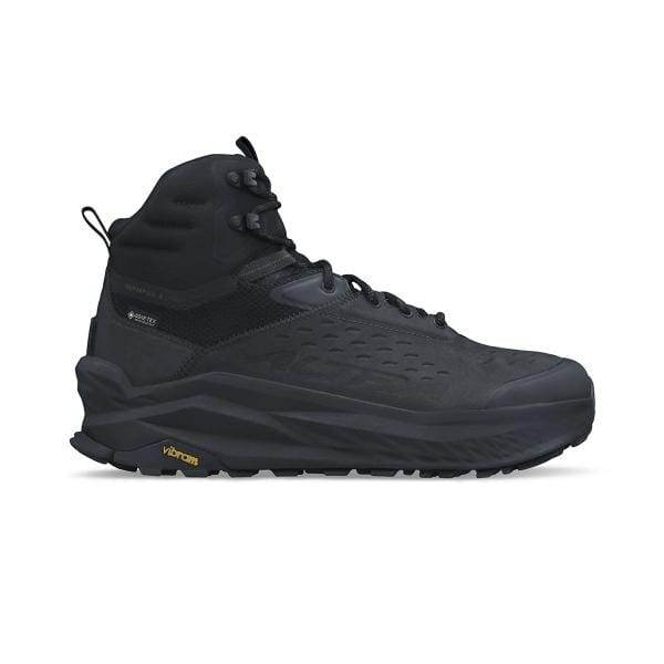 ה-Altra Olympus 6 Hike MID GTX AL0A85P000 הוא נעלי הליכה שחורות גבוהות עם דיטי מרקם, חזית שרוכים וסוליית Vibram עבה של המותג Altra.