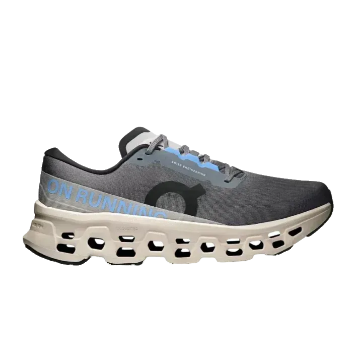 נעלי ריצה On Cloud Monster 3 לגברים, דגם Rock/Silver מבית On Cloud, בצבע אפור עם סוליה לבנה ורפידות כחולות, מעוצבות לנוחות ולביצועים מרביים.