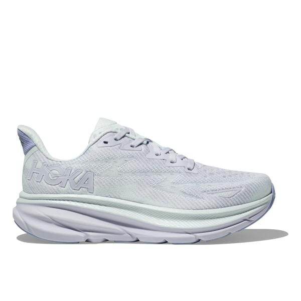 מבט מהצד של נעל ריצה Hoka 1127896/EHR CLIFTON 9 לבנה עם סוליה עבה ולוגו עדין בצד.