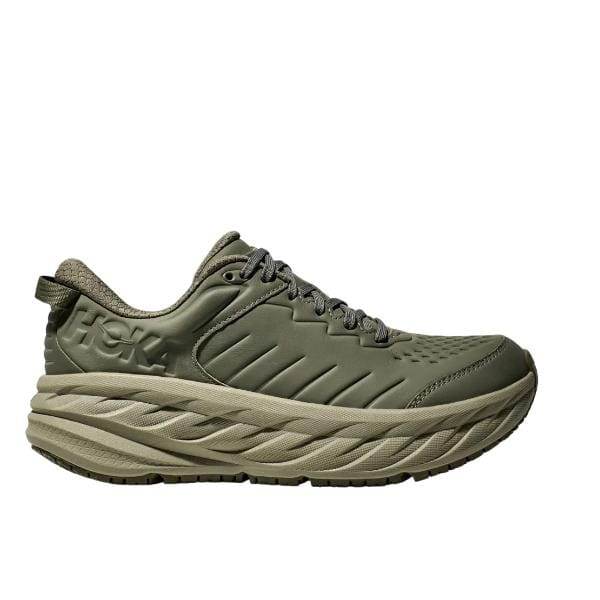 Hoka 1129350/OZB BONDI SR WIDE (2E) היא נעל אתלטית בצבע ירוק, הכוללת סוליה עבה ומרופדת. העיצוב כולל חלק עליון בעל מרקם עם חזית שרוכים ולולאת עקב. לוגו המותג "HOKA" מוצג בולט בצד.