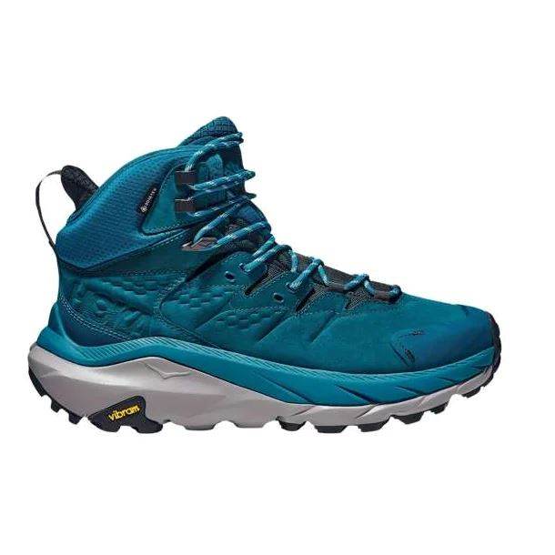 הכירו את Hoka Kaha 2 GTX B בגווני כחול קורל וגרפיט שחור, נעלי הליכה גבוהות עם צבע כחול נועז, סוליה מחוספסת ופסיכה שחורה ואפורה.