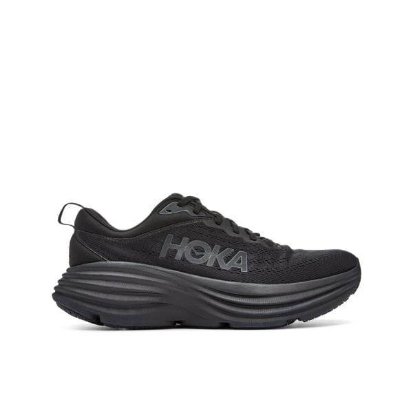 Hoka BONDI 9 1162016/BBLC X-WIDE היא נעל ריצה שחורה עם סוליה עבה, "HOKA" מעוטרת בצד, הכוללת עיצוב שרוכים ולשונית משיכה בעקב.