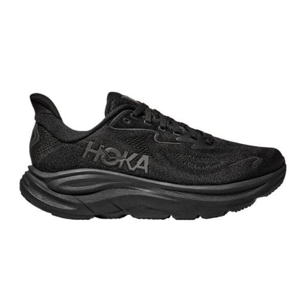 Hoka CLIFTON 10 1162032/BBLC WIDE BLACK היא נעל ריצה שחורה של Hoka עם סוליה עבה וחלק עליון של רשת, המוצגת מהצד.