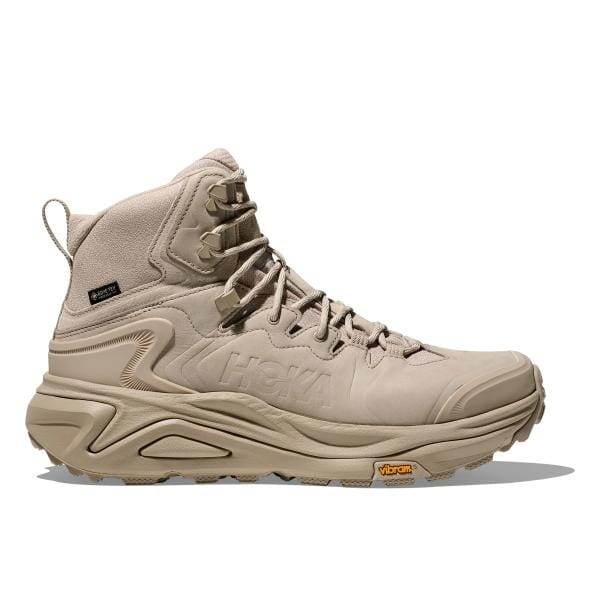 נעלי הליכה Tan Hoka 1162530/RWL KAHA 3 GTX RAW LINEN עם עיצוב קרסול גבוה, סוליה מחוספסת ולוגו "HOKA" בצד.
