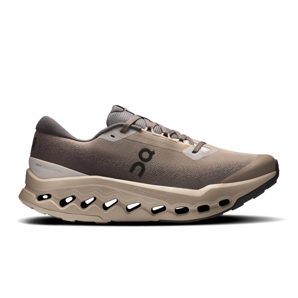 On Cloudsurfer Trail 2 WP CinderDesert (3MF30243318) הוא נעל ריצה לגברים בצבעי בז' וחום מבית On Cloud, עם סוליה גלית, חורי אוורור ולוגו On המוכר בצד.