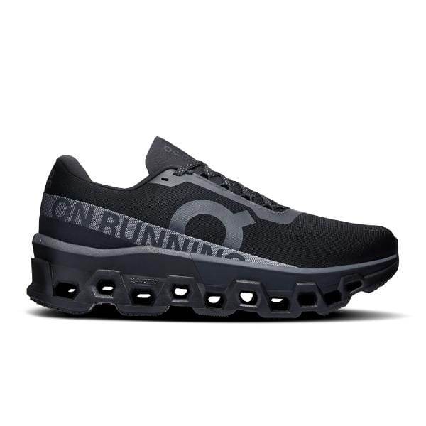 ה-On Cloudmonster 2 Black/Black 3ME10121043 מאת On Cloud היא נעל אתלטית שחורה הכוללת חלק עליון רשת וסוליה מרופדת עם גזרות משושה.
